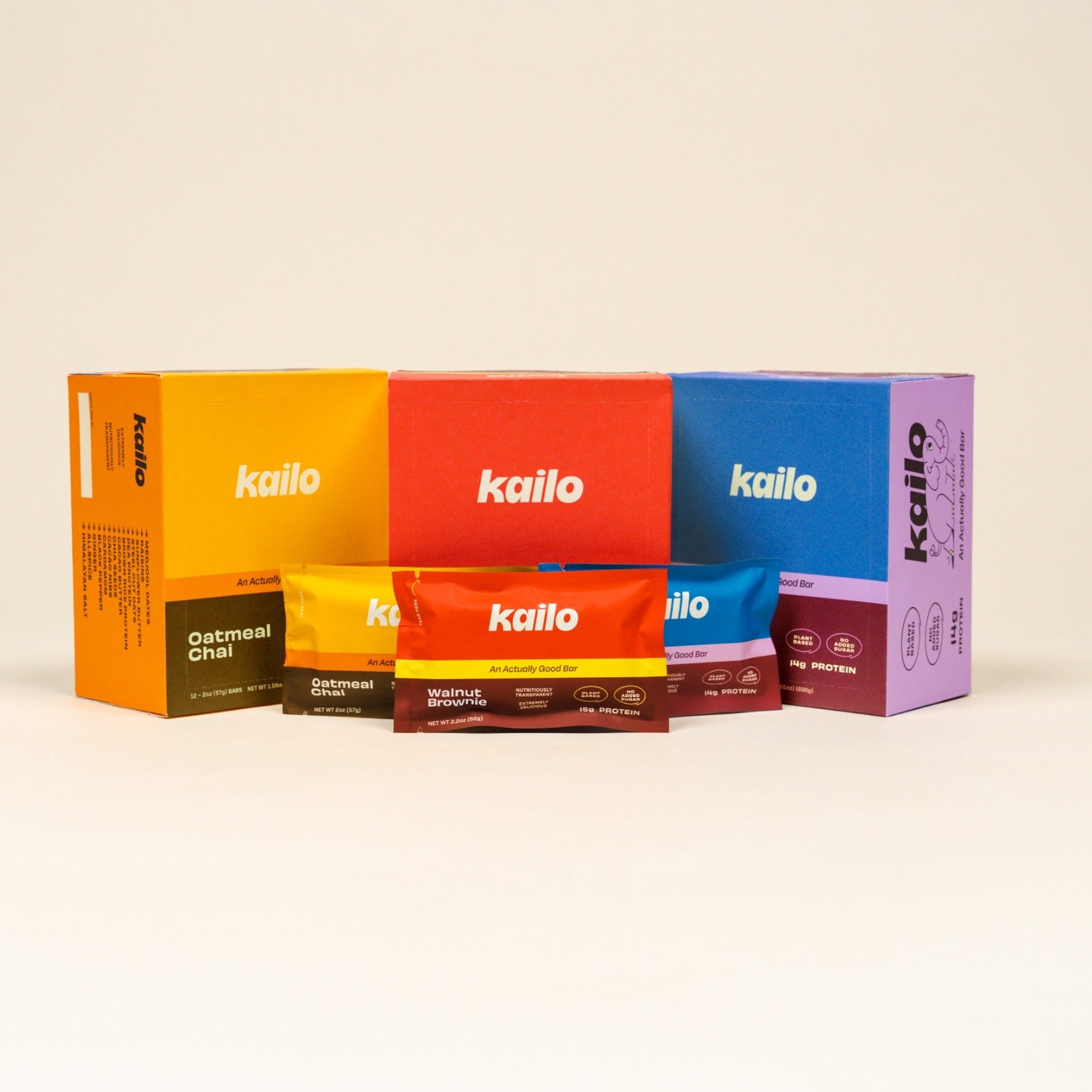 Colorful Kailo protein bar packaging on a beige background