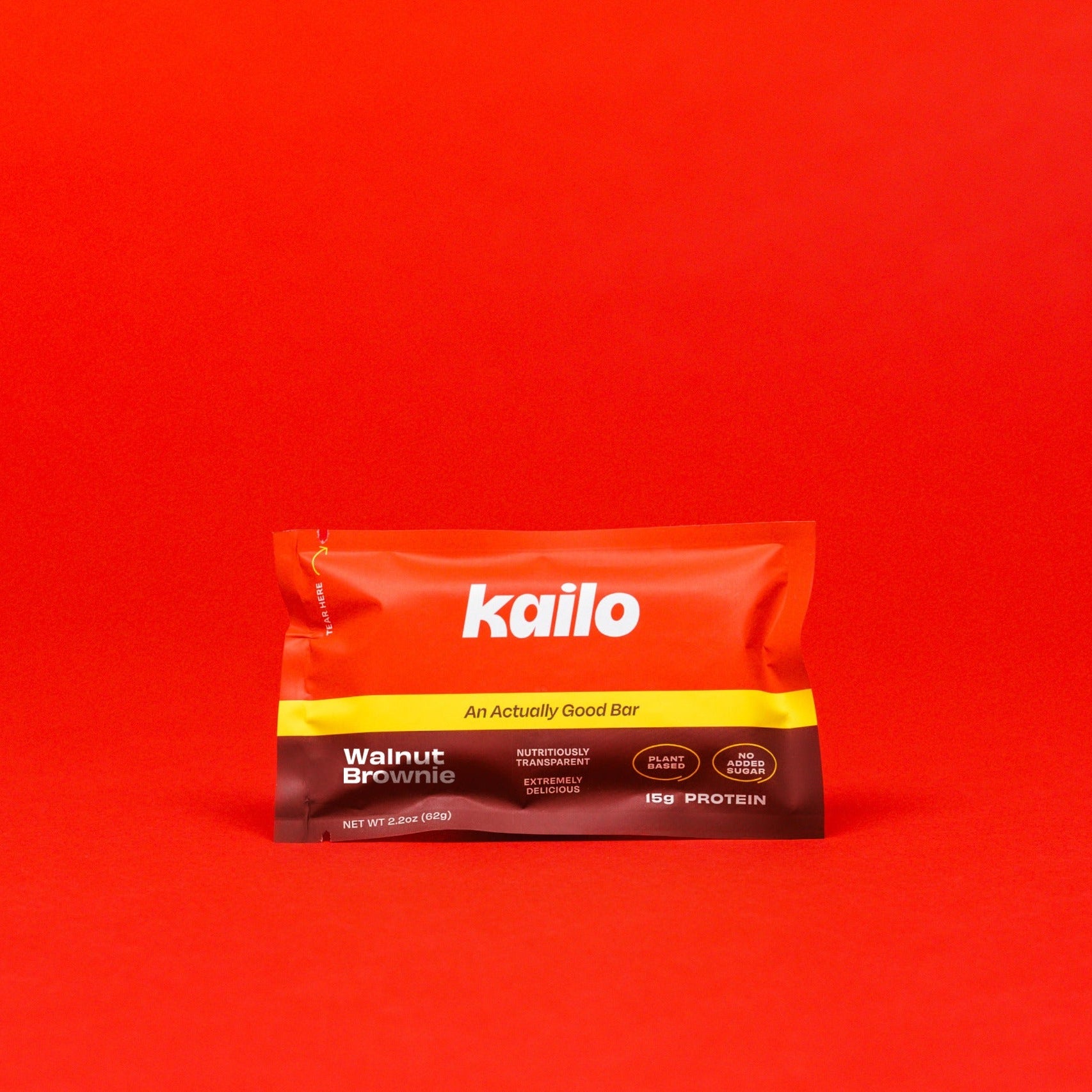 Kailo Walnut Brownie Protein Bar on Red background
