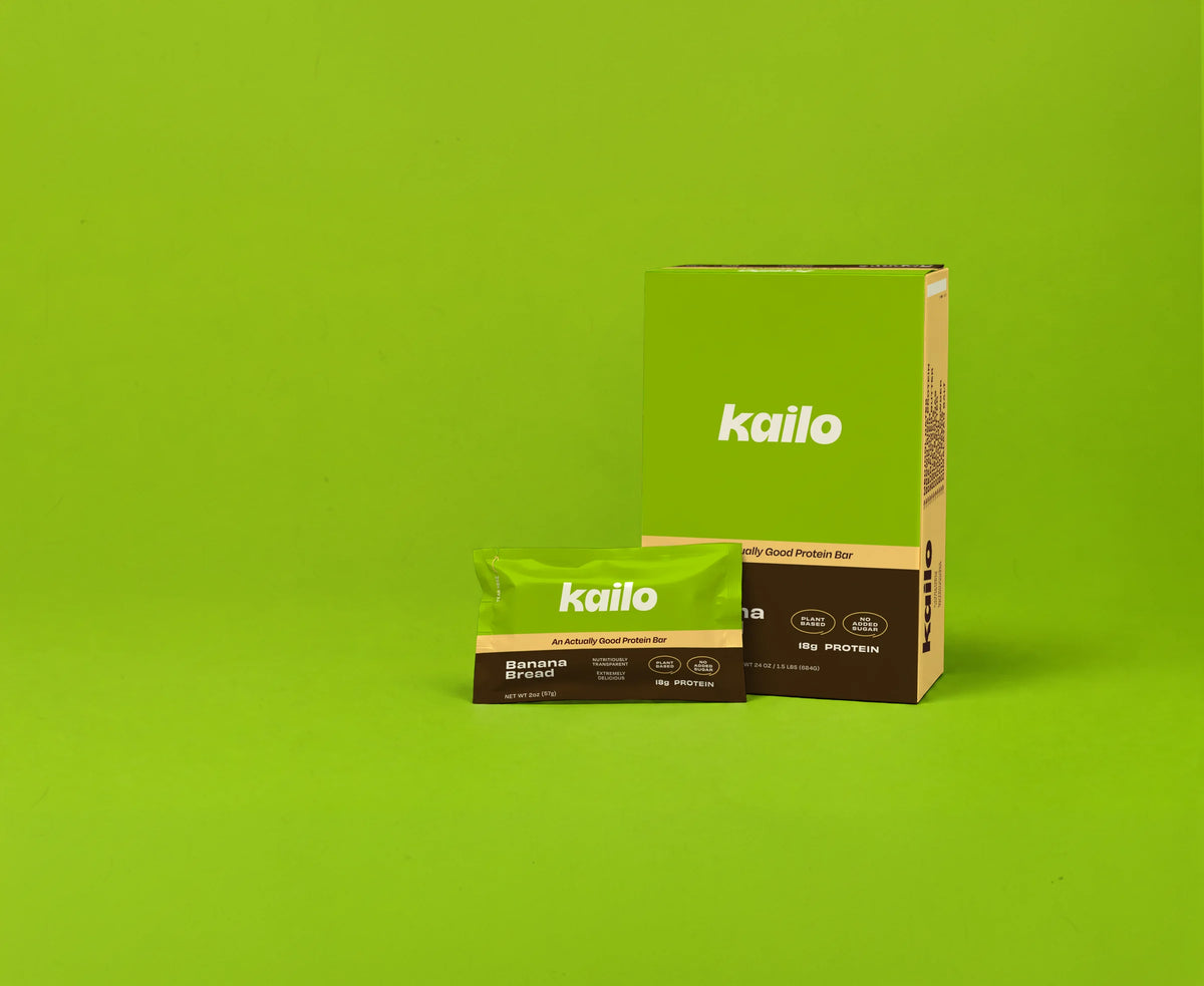 Kailo Banana Bread 12-pack carton and protein bar pouch on a green background