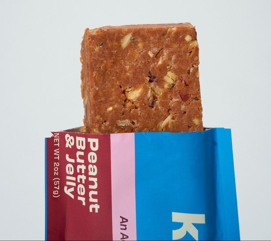 A Kailo Peanut Butter and Jelly bar broken open to show the texture